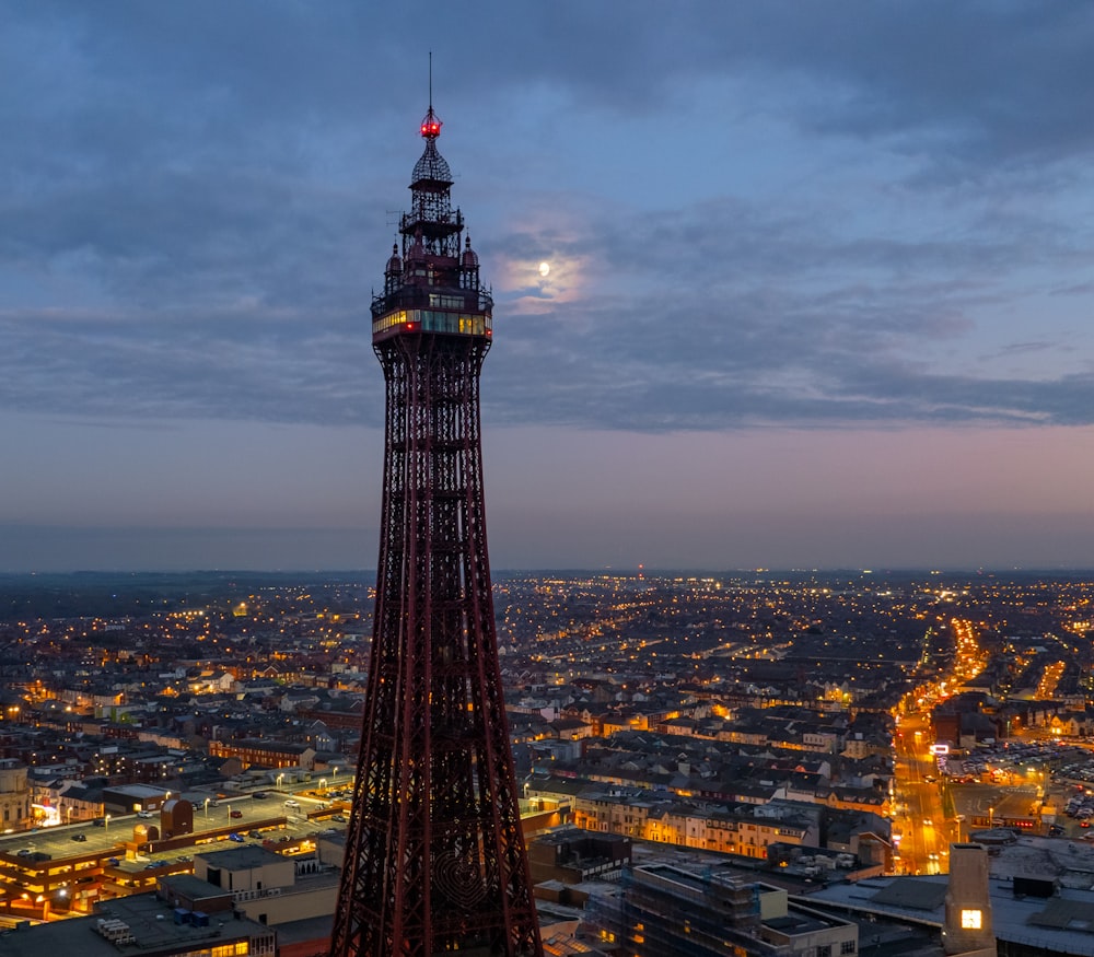 a very tall tower with a clock on it's side