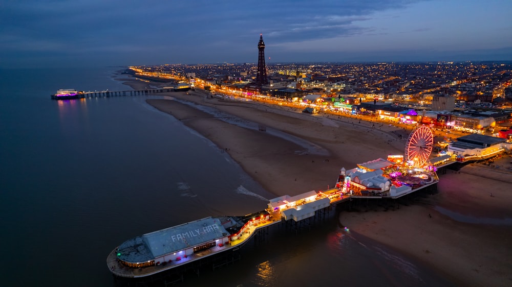 an aerial view of a pier at night