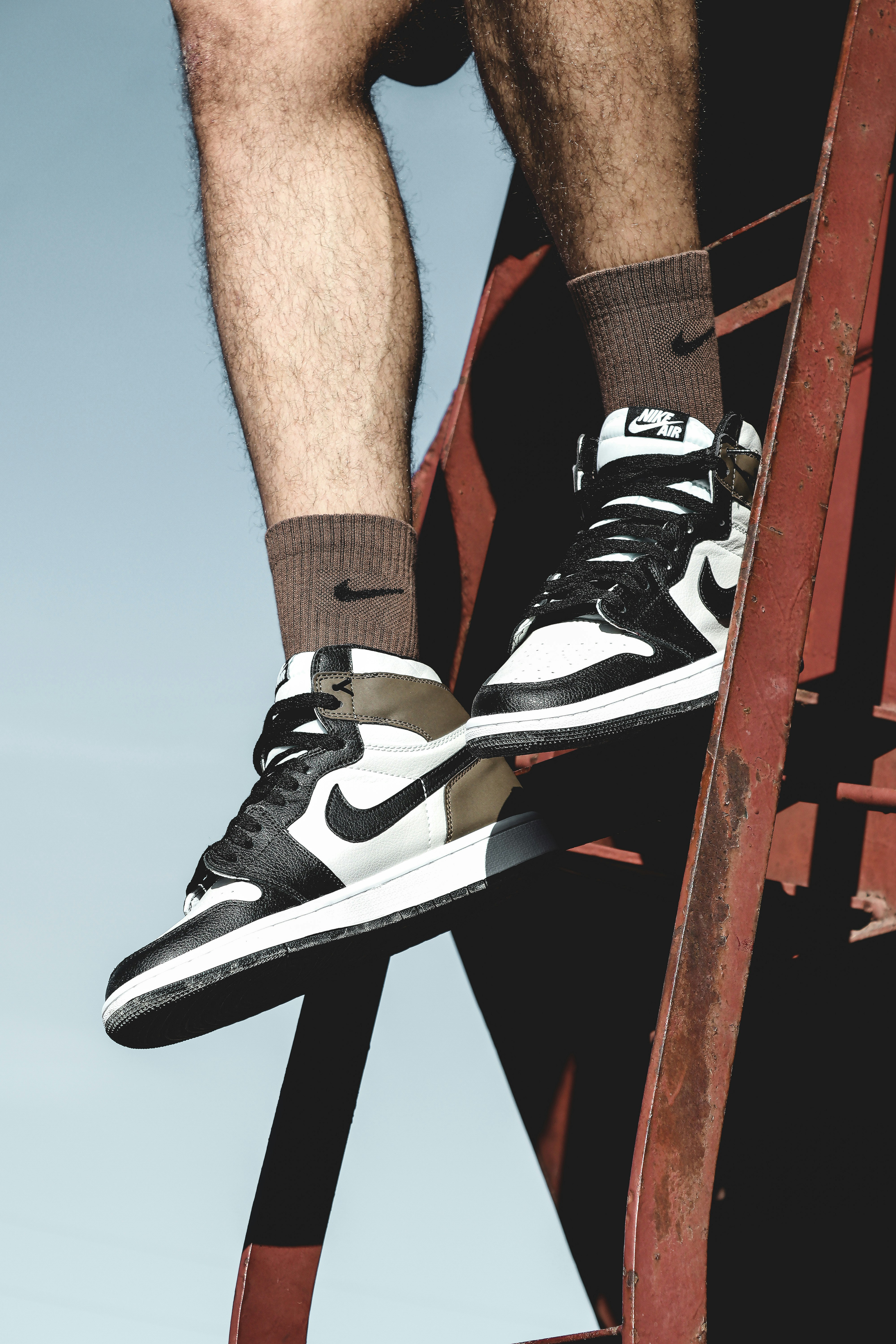 a man standing on top of a ladder