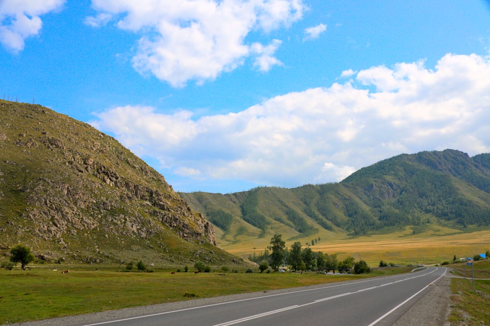 a road with a mountain in the background