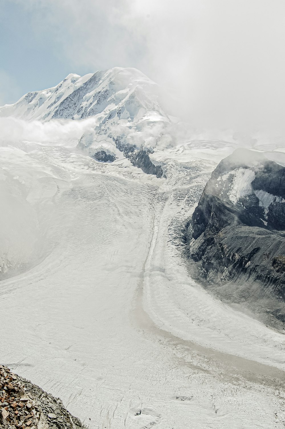 a man riding skis down a snow covered slope