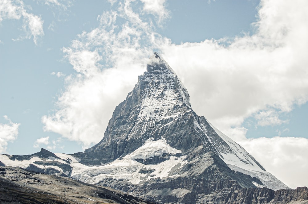 a very tall mountain with snow on it