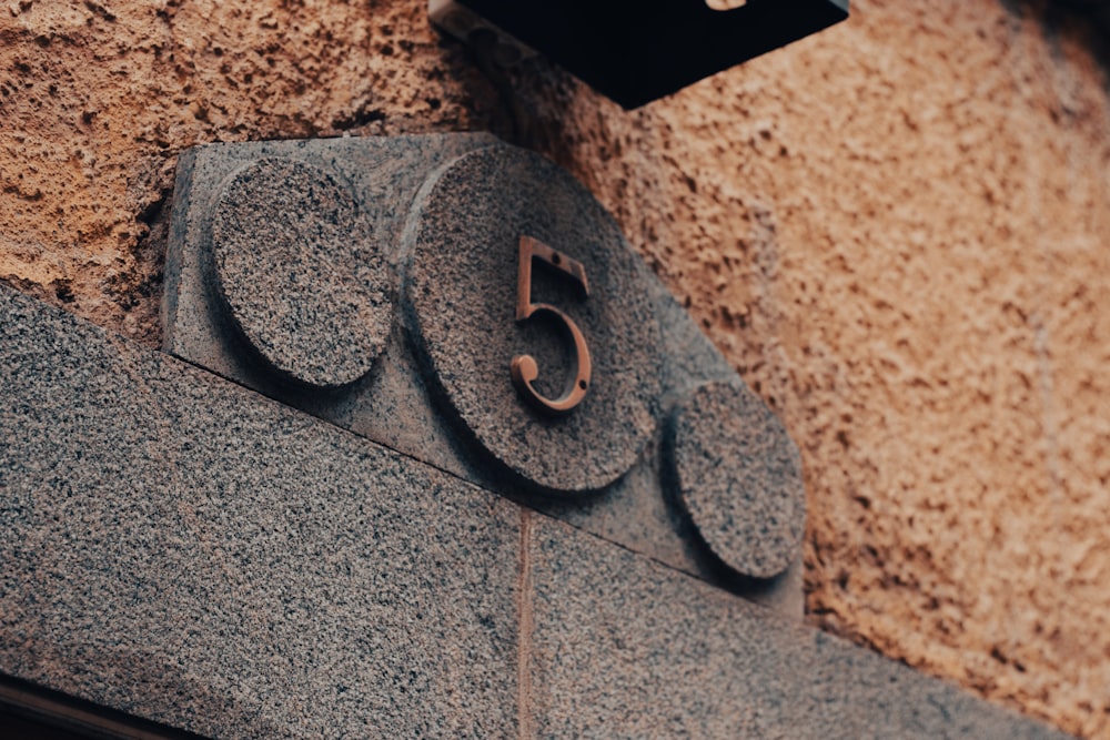 a close up of the number five on a building