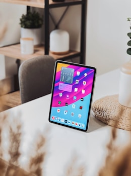 a tablet computer sitting on top of a table