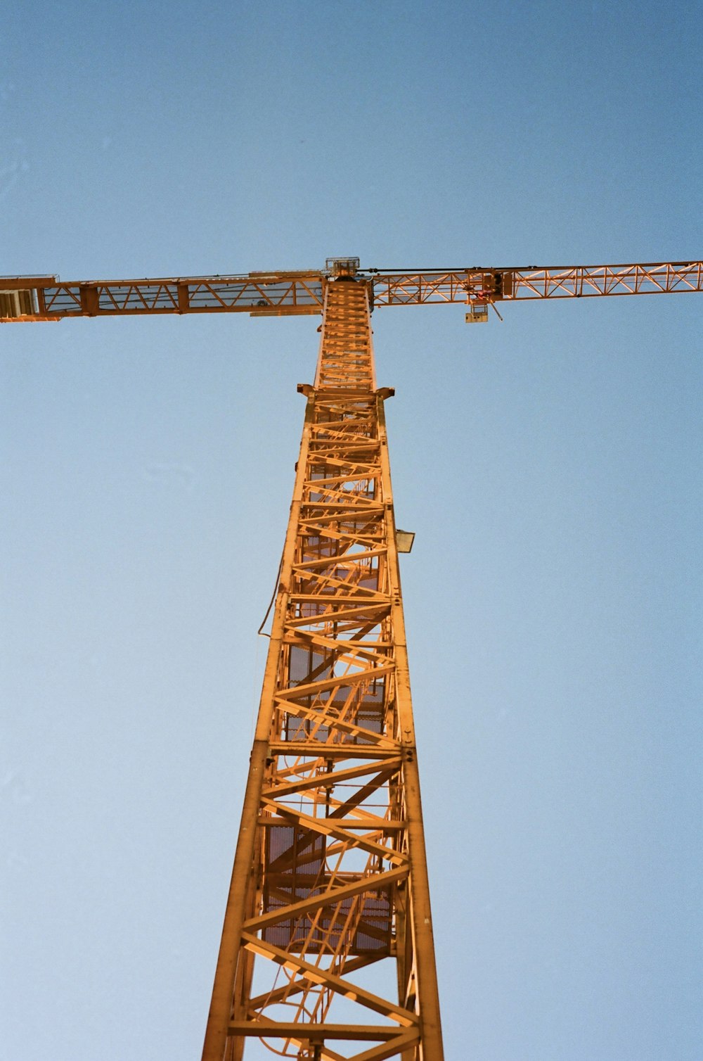 a tall tower with a crane on top of it
