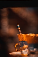 Close-up of a beautifully customized glass cup with vibrant colors and intricate design.