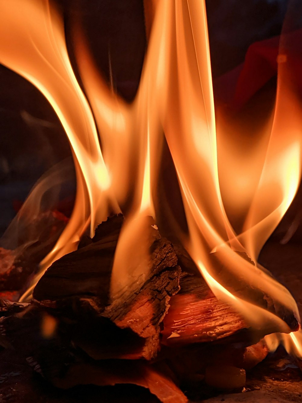 a close up of a fire with flames coming out of it