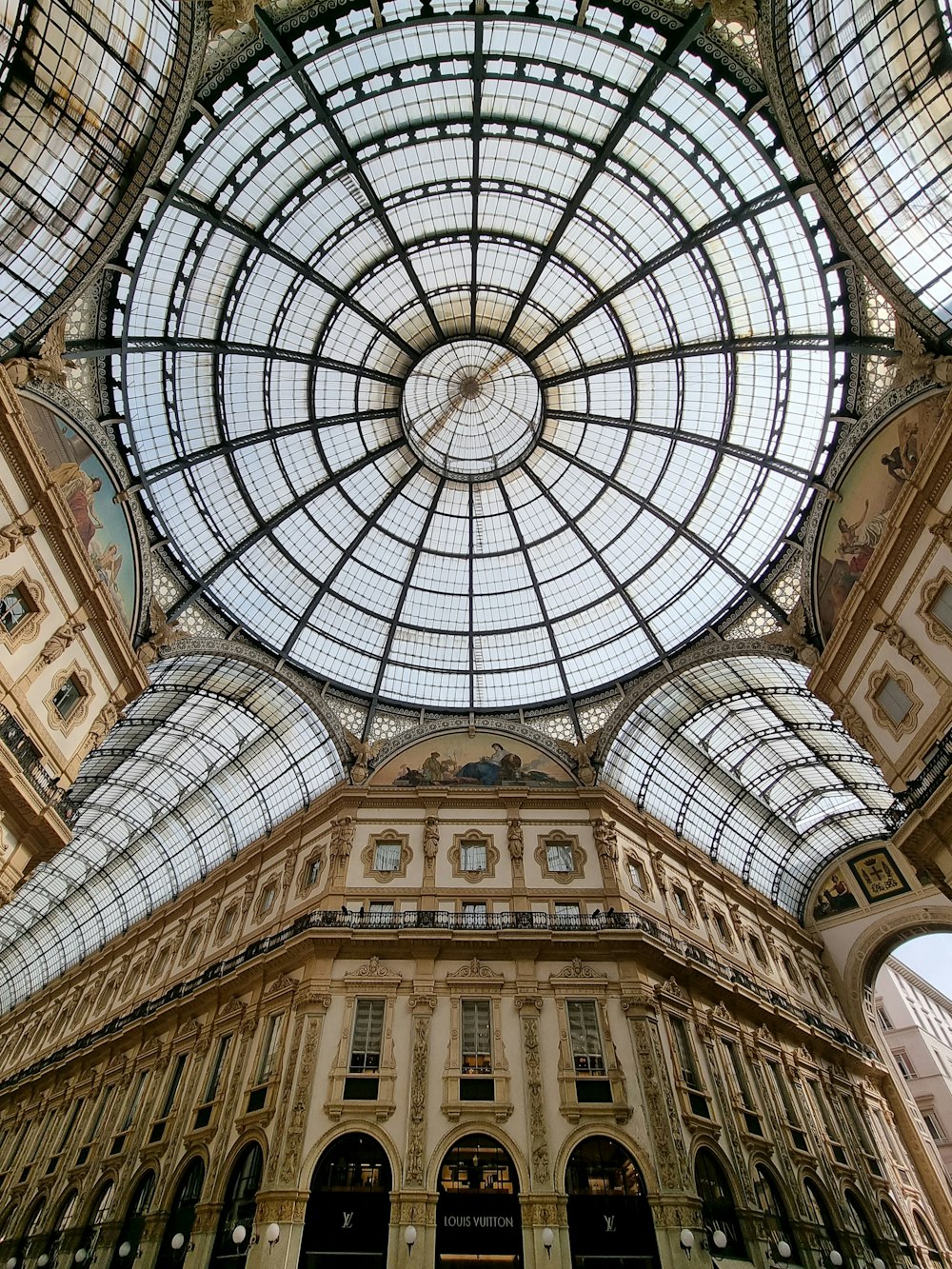 the ceiling of a building with a glass dome