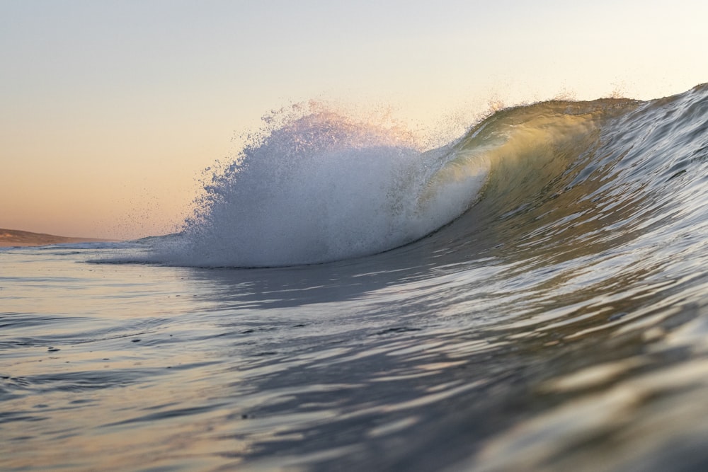 a large wave is coming towards the shore