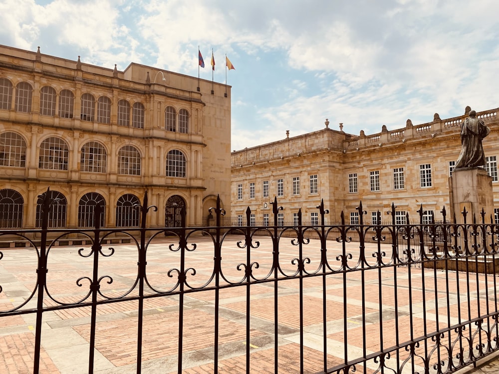 a large building with a statue in front of it