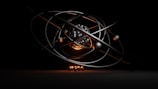 A 3D rendering of an abstract atomic structure composed of metallic rings orbiting a central cluster of spheres with glowing light effects. The scene is dark, highlighting the glowing elements and metallic sheen.