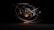 A 3D rendering of an abstract atomic structure composed of metallic rings orbiting a central cluster of spheres with glowing light effects. The scene is dark, highlighting the glowing elements and metallic sheen.