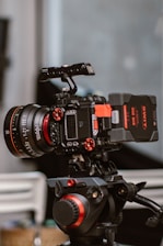 a video camera sitting on top of a tripod