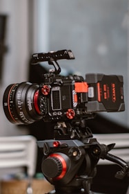 a video camera sitting on top of a tripod
