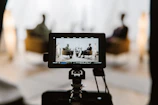 a tripod with a camera attached to it
