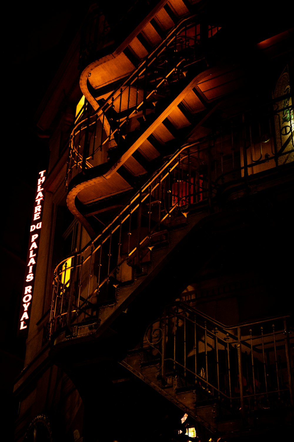 a building with a lit up sign on the side of it