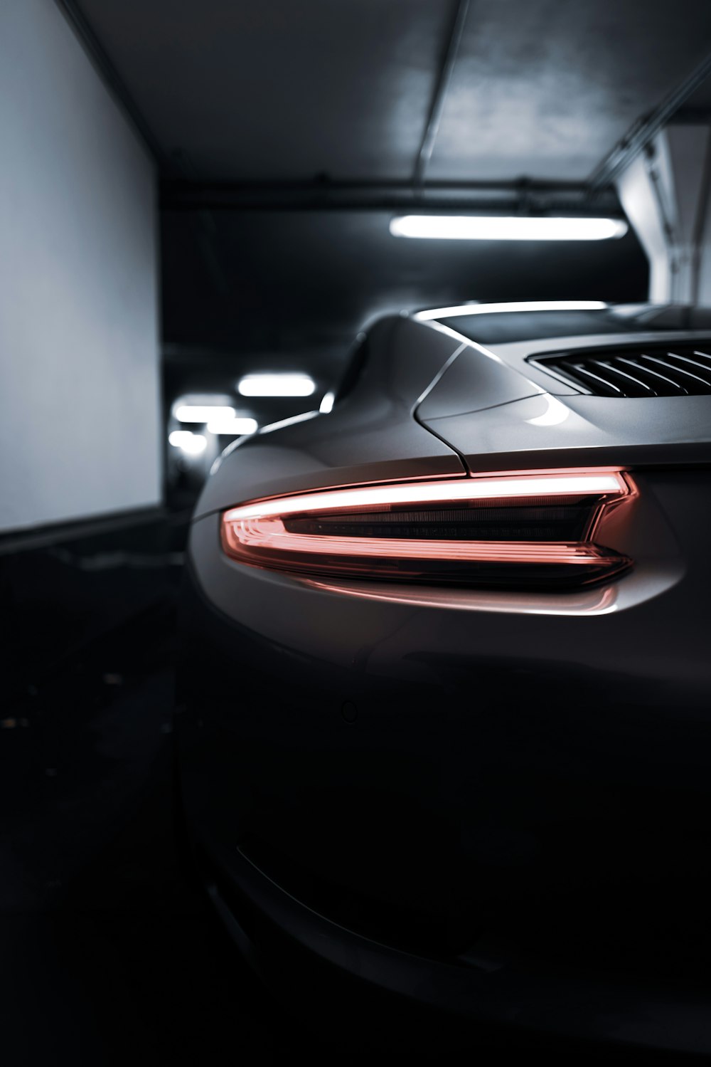 a close up of the tail lights of a sports car