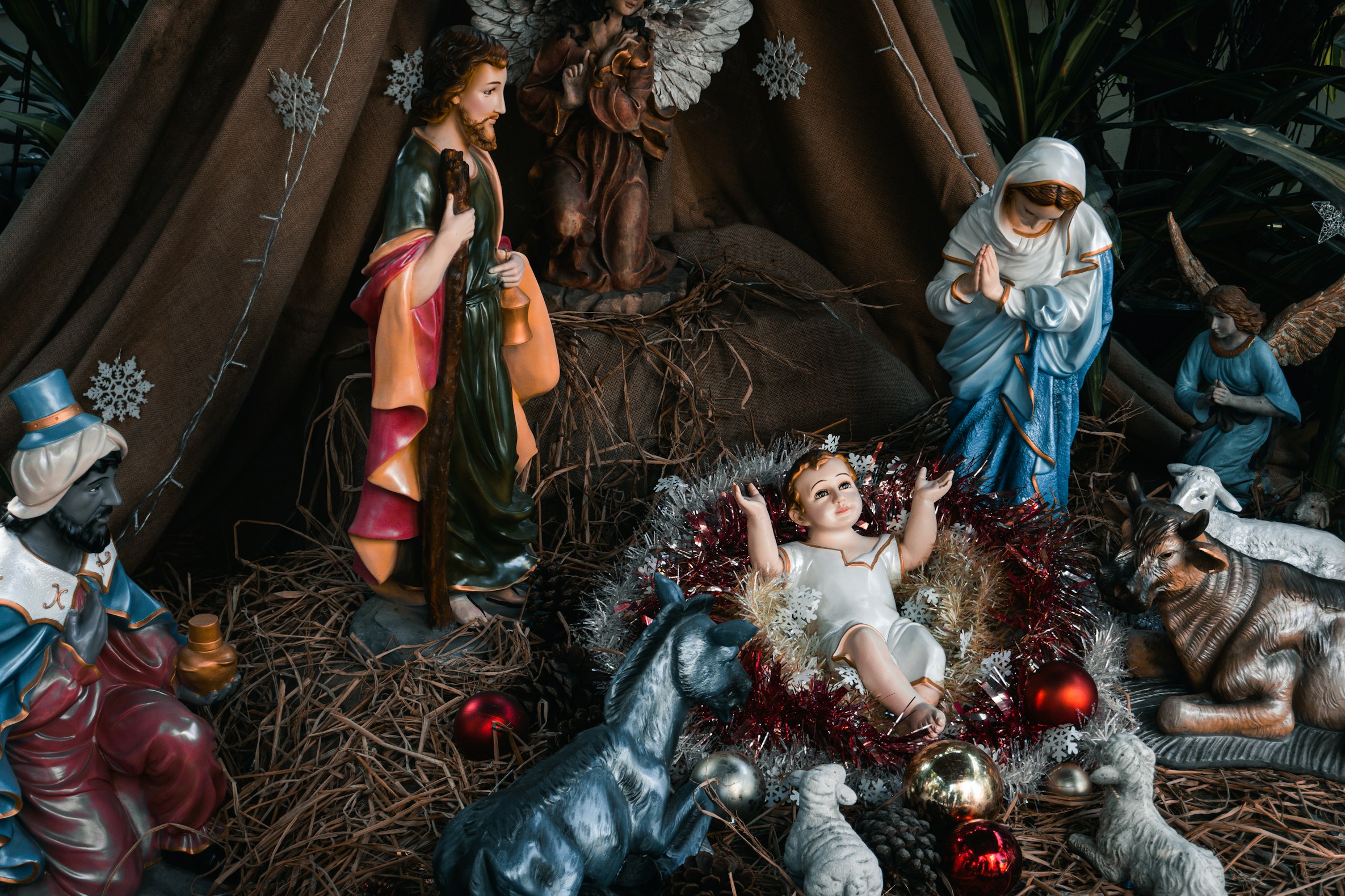 Photo by [Xulong Liu](https://unsplash.com/photos/a-nativity-scene-of-a-baby-jesus-surrounded-by-christmas-decorations-kT_JlNZ3pdM) on [Unsplash](https://unsplash.com/)