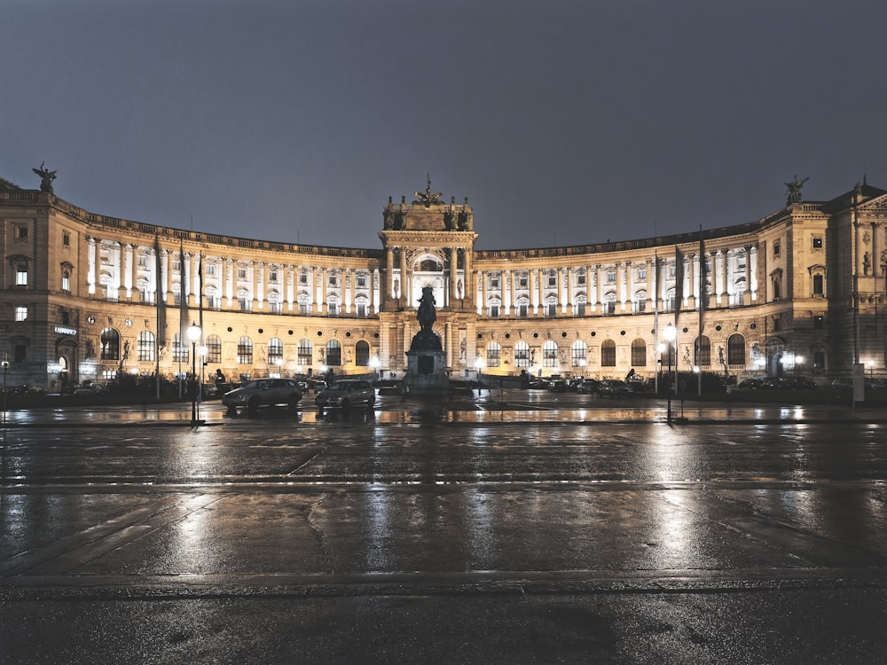 a large building with a fountain in front of it