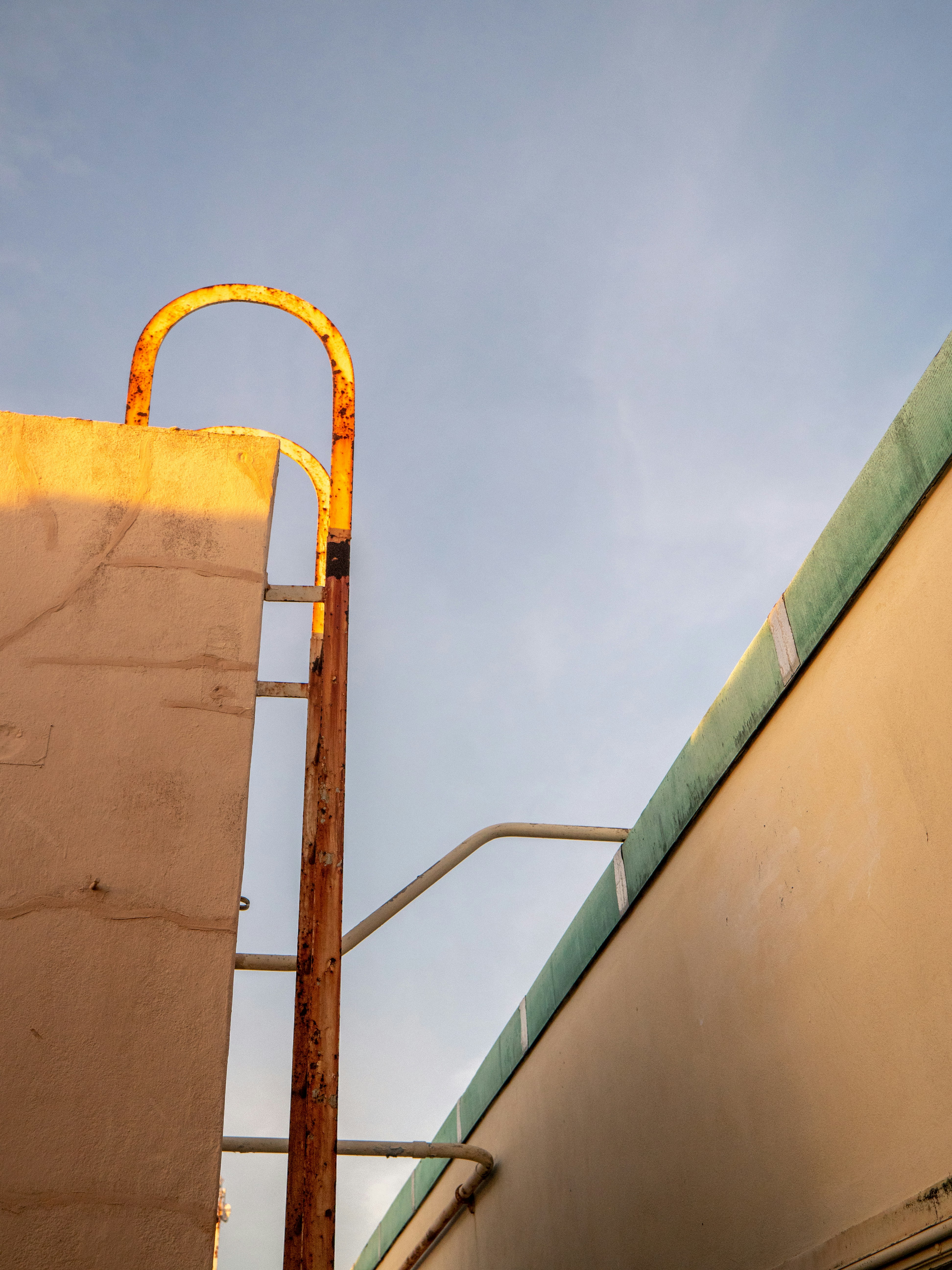 a yellow fire hydrant sitting next to a building