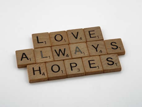 scrabble tiles spelling love always hopes