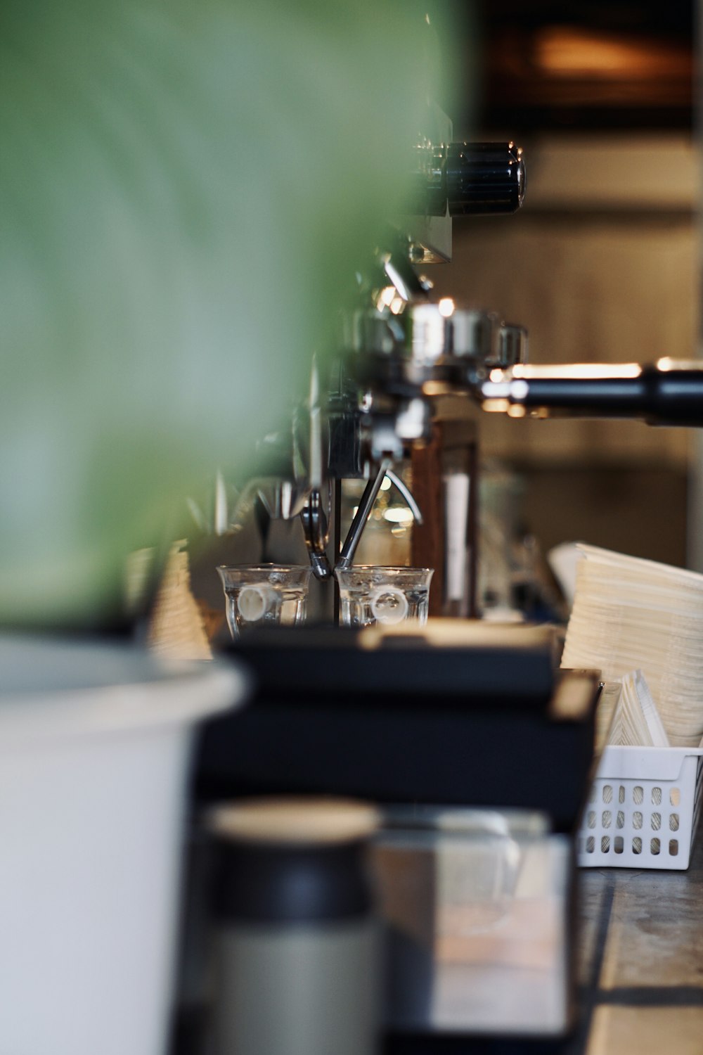 a row of coffee machines sitting on top of a counter