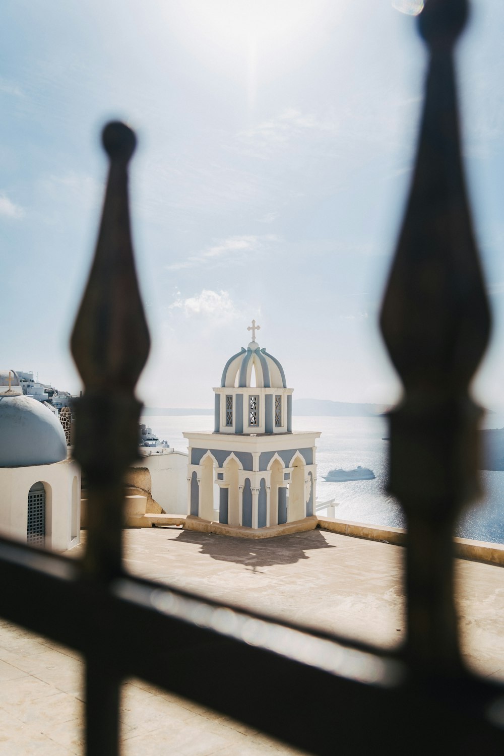 a view of a church through a fence