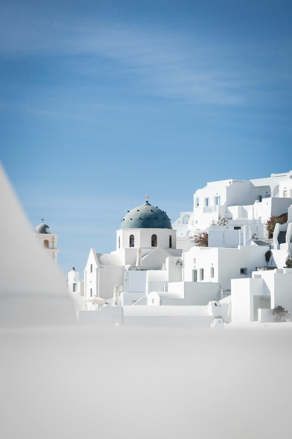 a white building with a blue dome on top of it