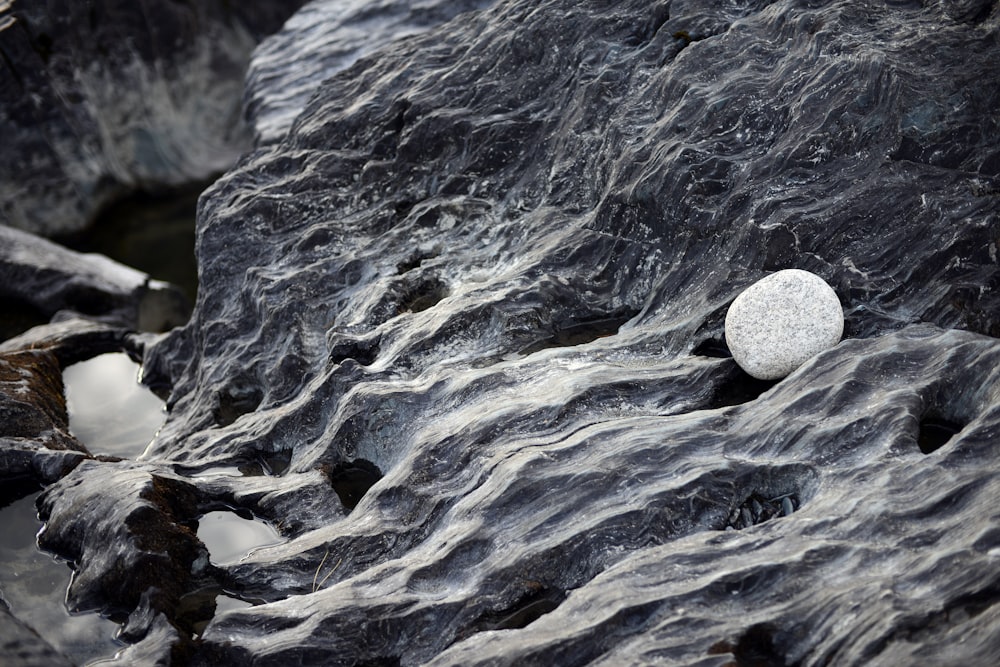 a rock with a white circle sitting on top of it