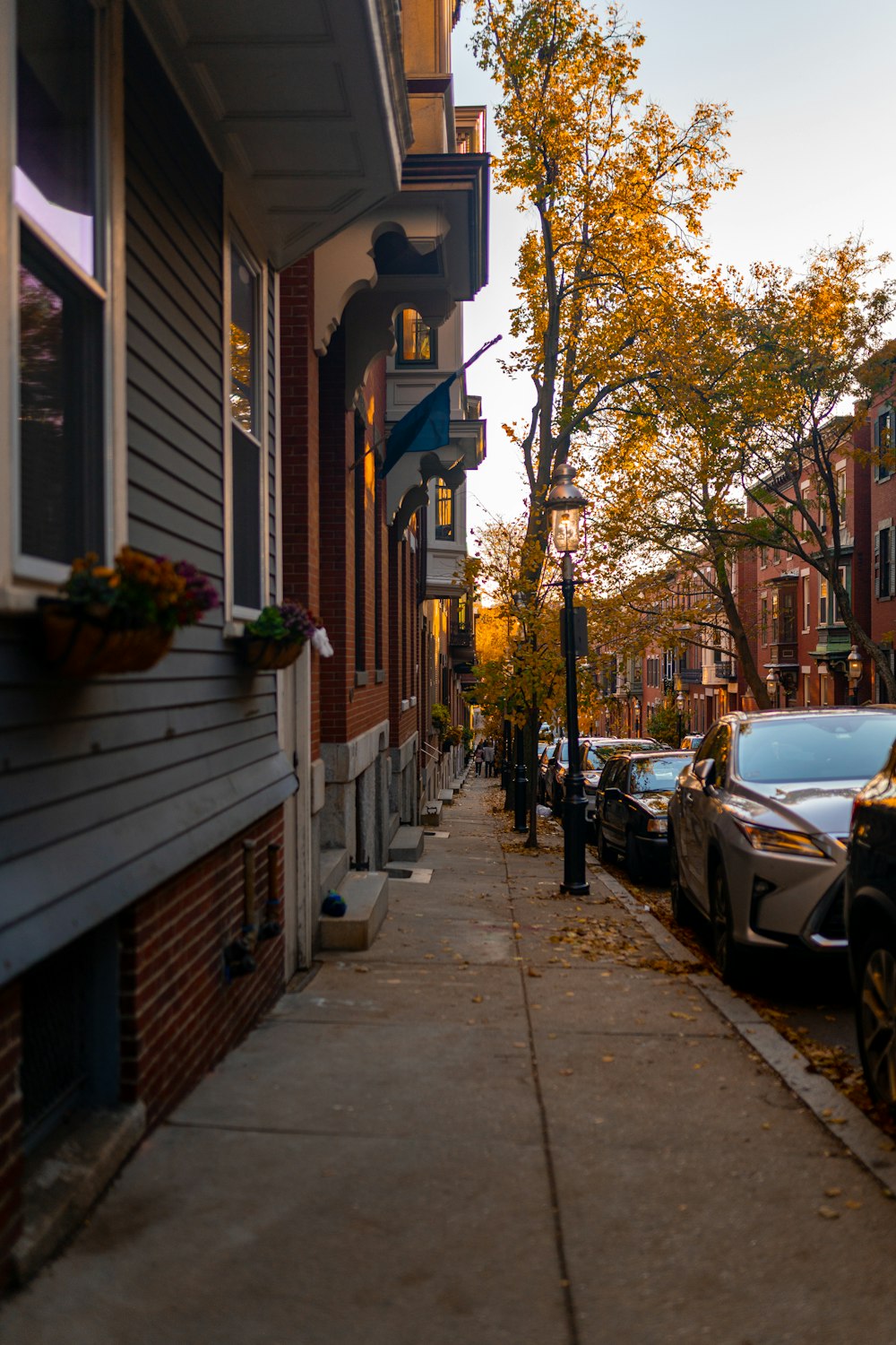 a city street with parked cars on the side of it