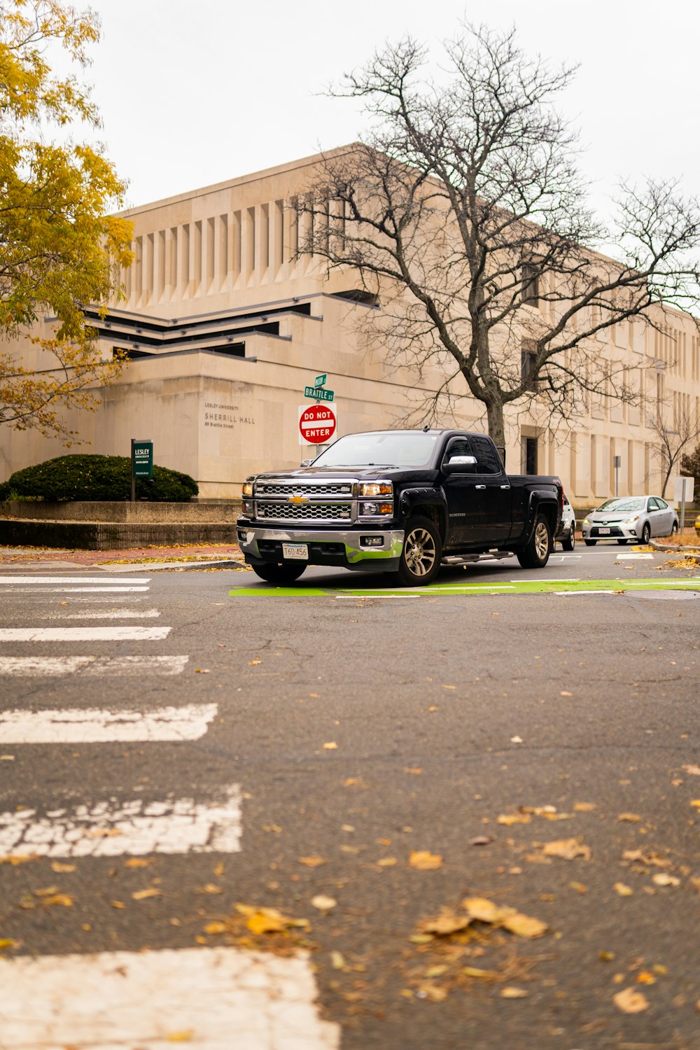 a black truck parked on the side of the road