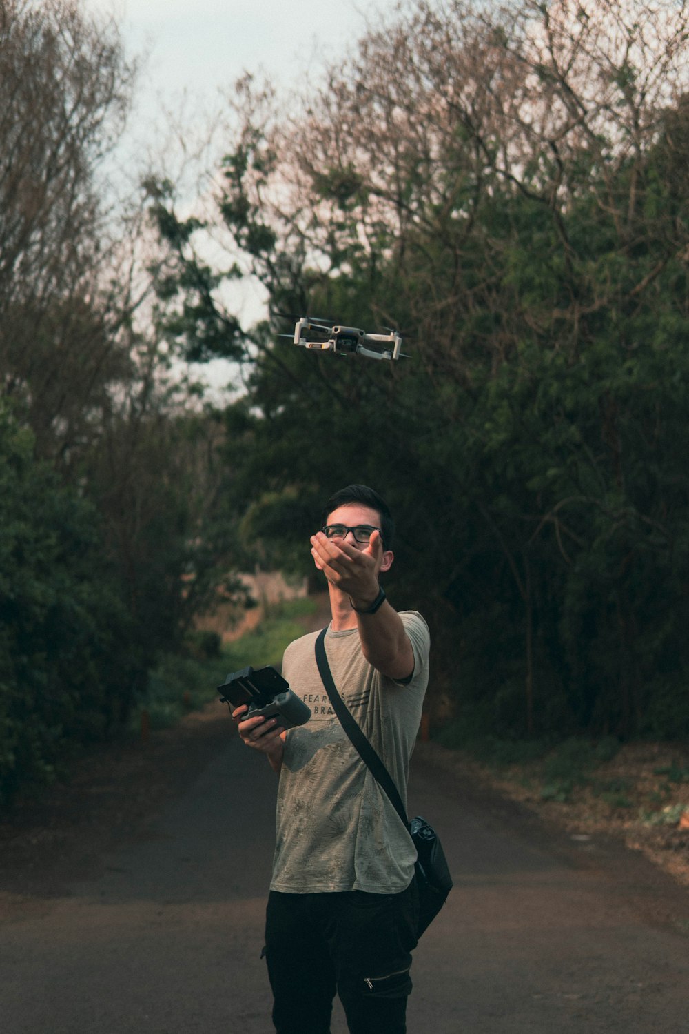 a man taking a picture of a flying object