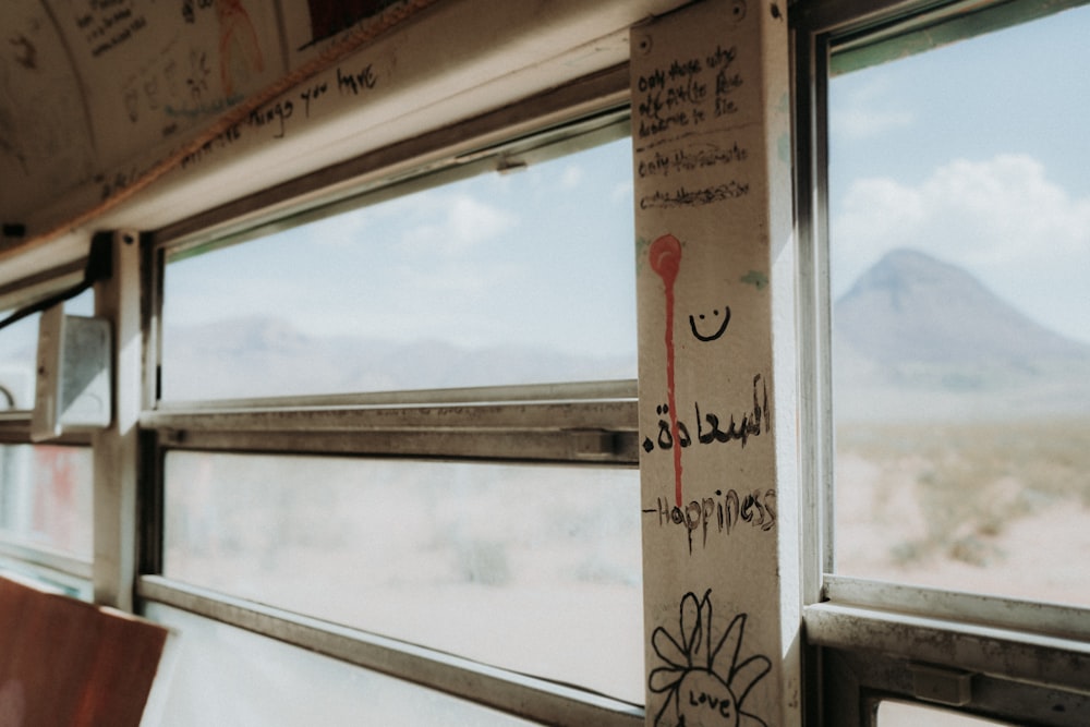 a window with graffiti on the side of it