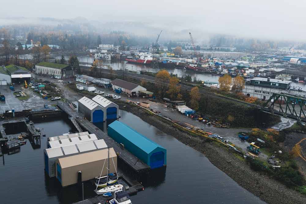 an aerial view of a harbor with boats and buildings