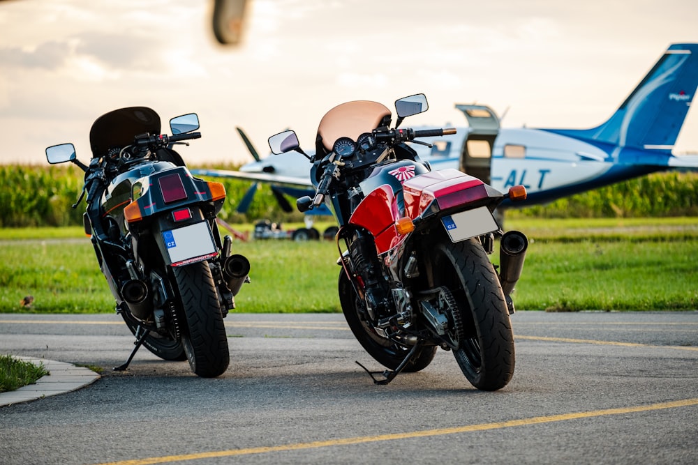 two motorcycles parked next to each other on a runway