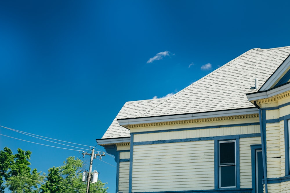 a blue and white house with a white roof