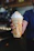 A close-up of a creamy frappe topped with whipped cream and caramel drizzle.