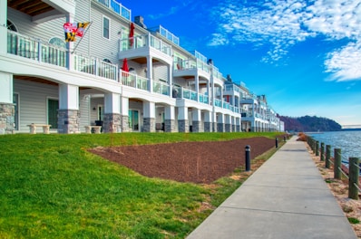 a row of apartment buildings next to a body of water