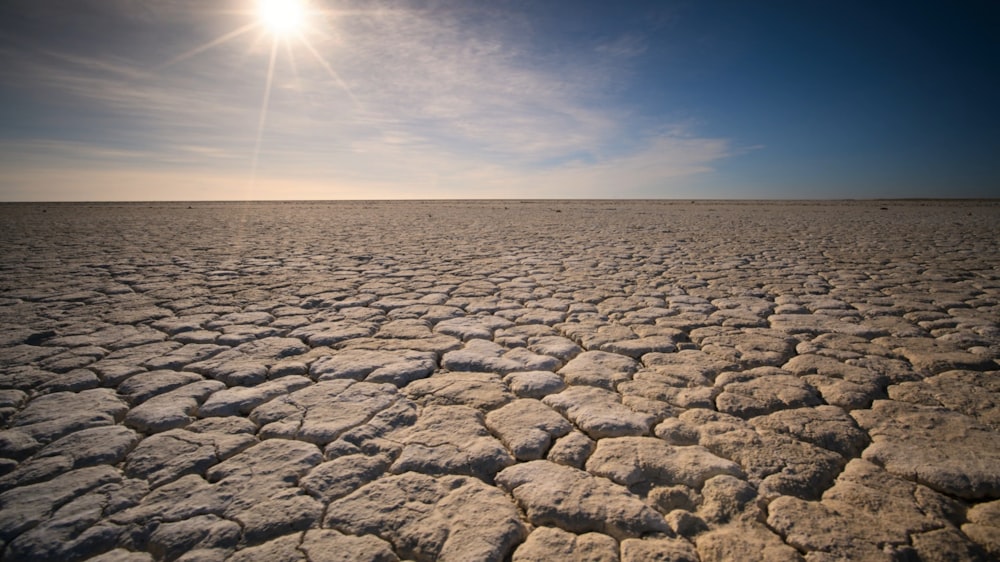 the sun is shining over a vast expanse of land