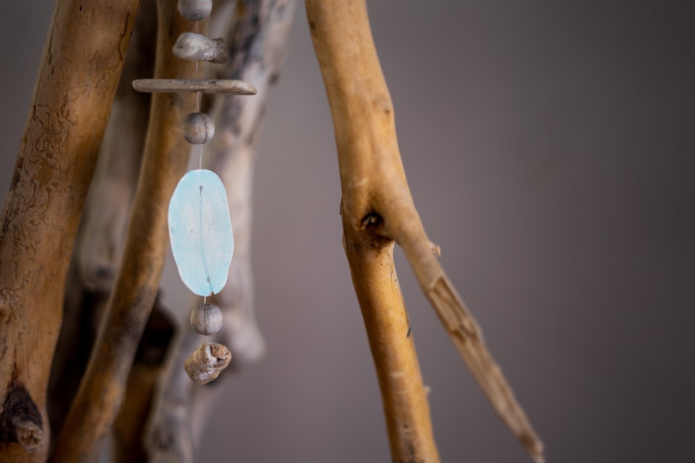 a wind chime hanging from a tree branch