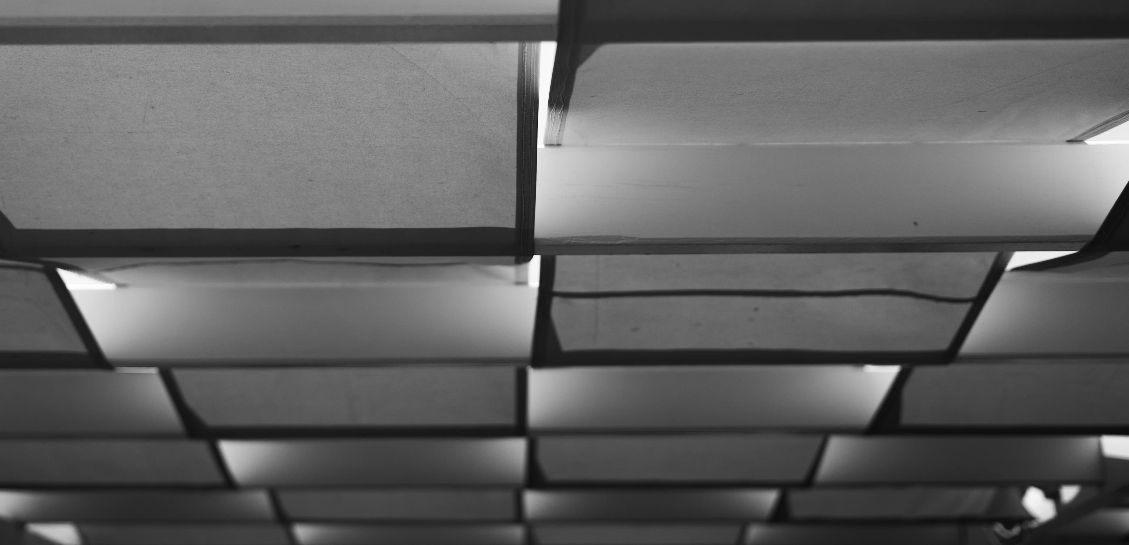 Acoustic baffles hung across a ceiling