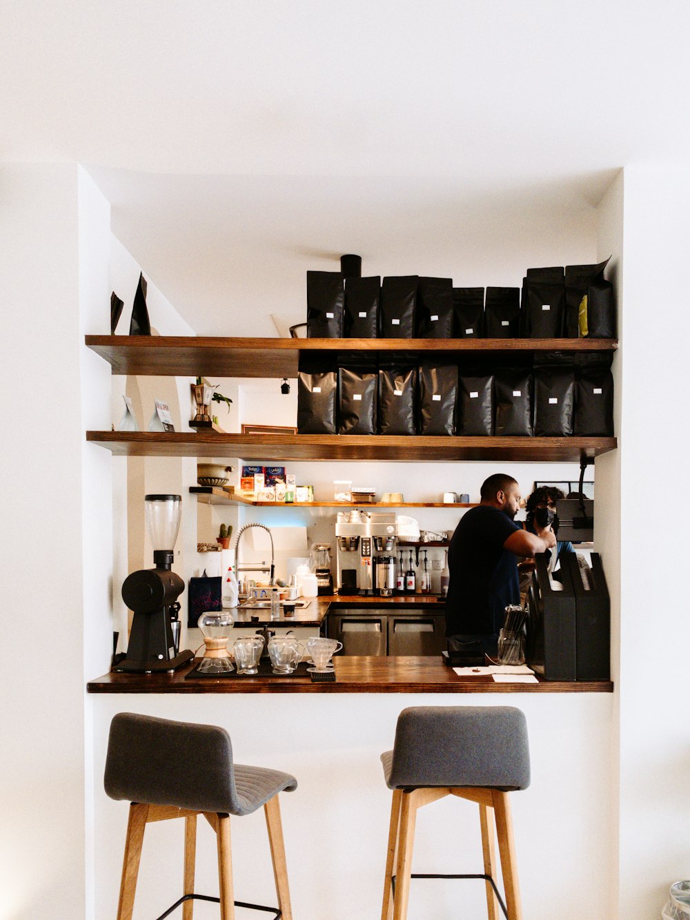 a couple of stools sitting in front of a counter