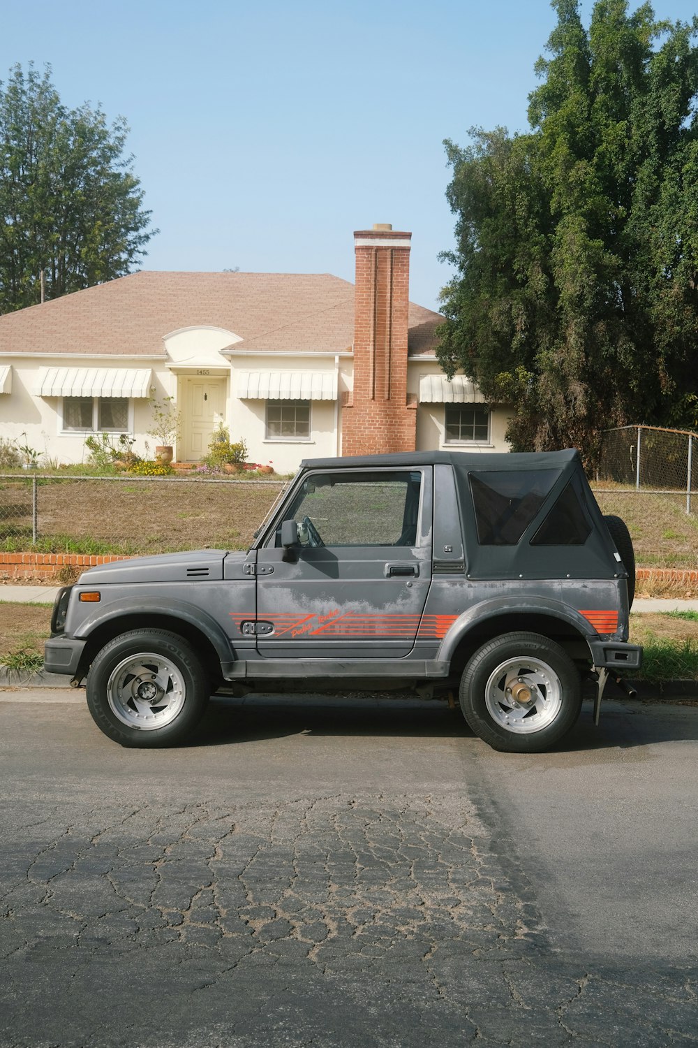 a gray truck parked in front of a house