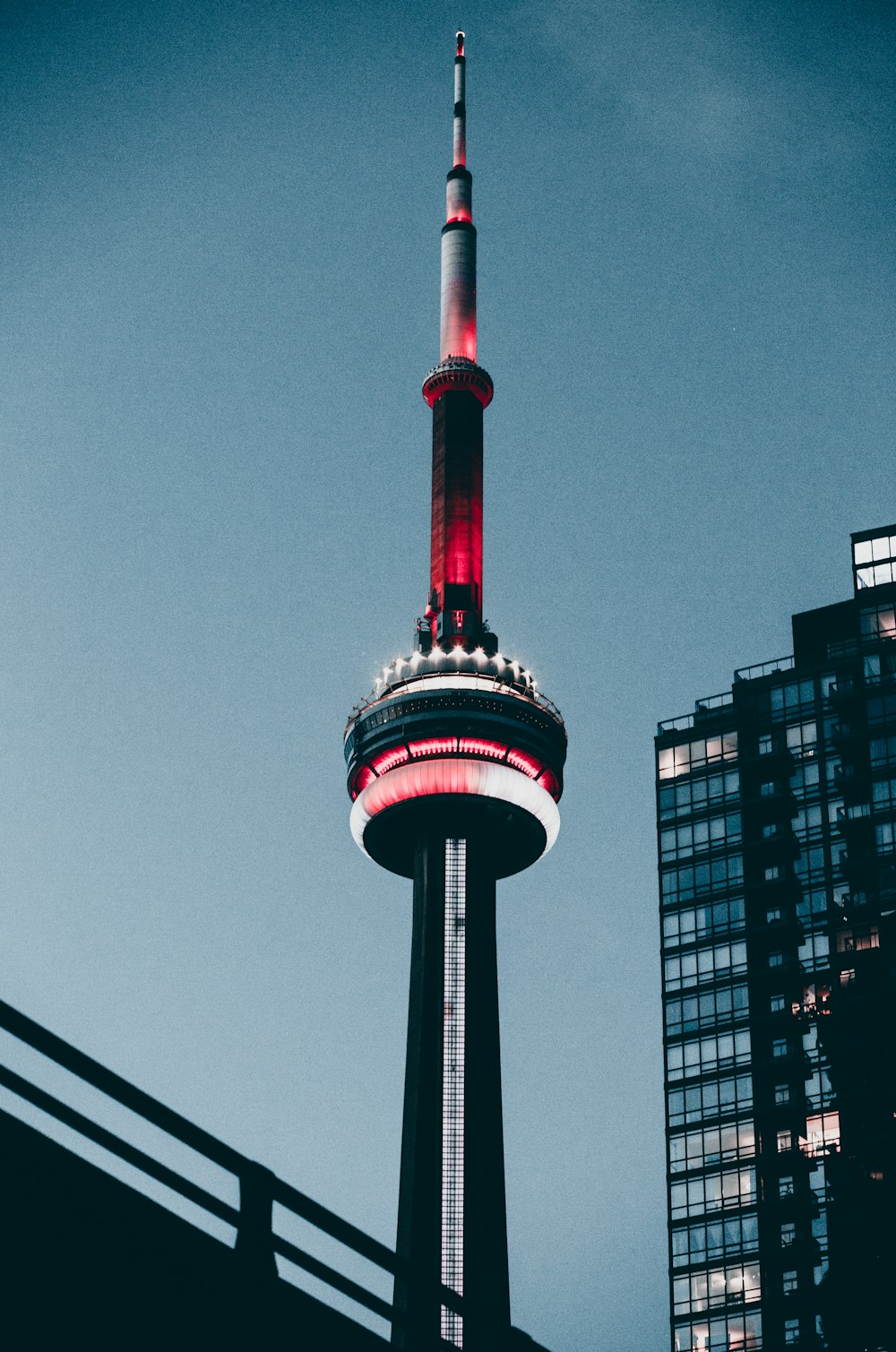 a tall tower with a red light on top of it