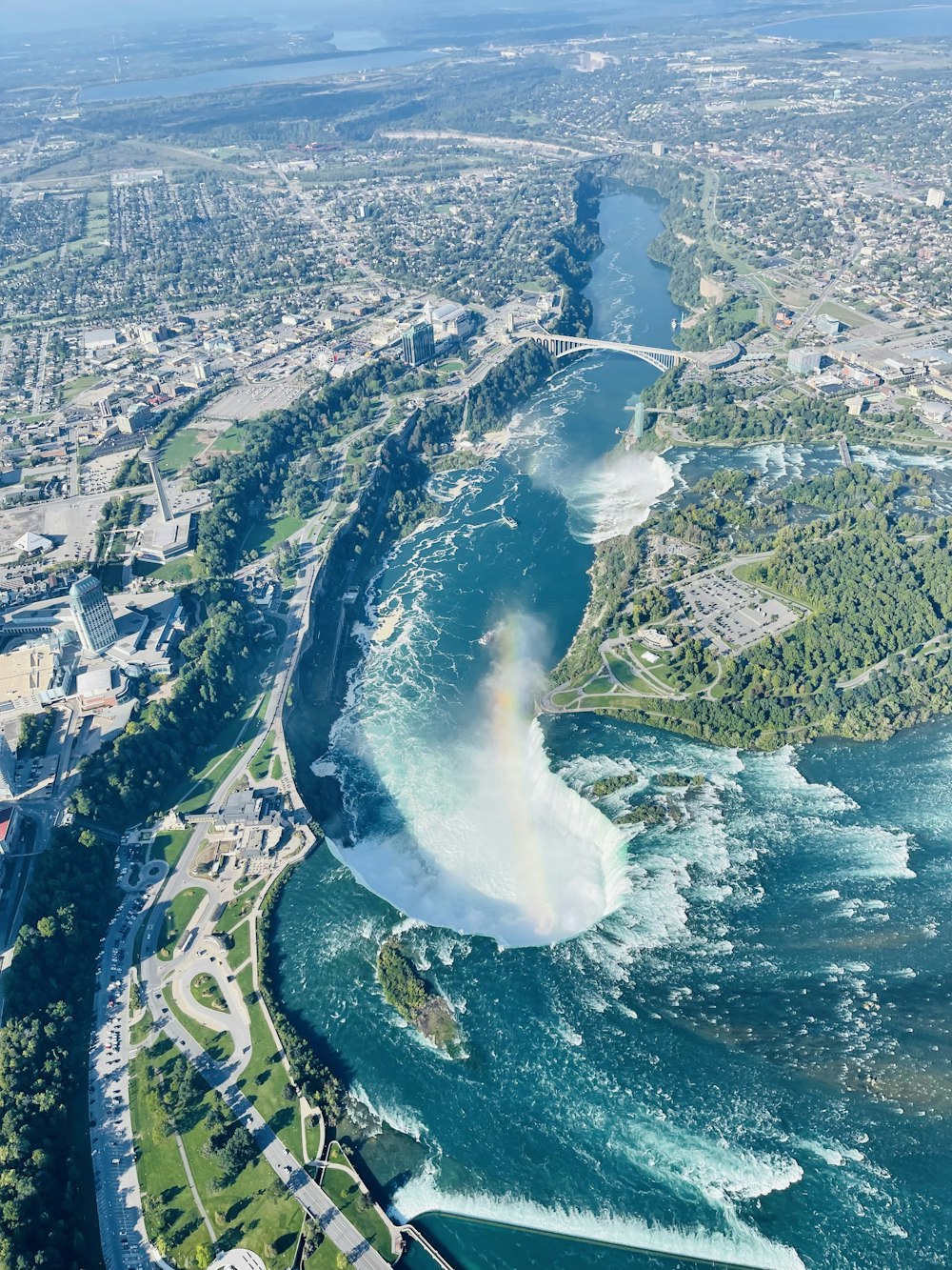 an aerial view of a river running through a city