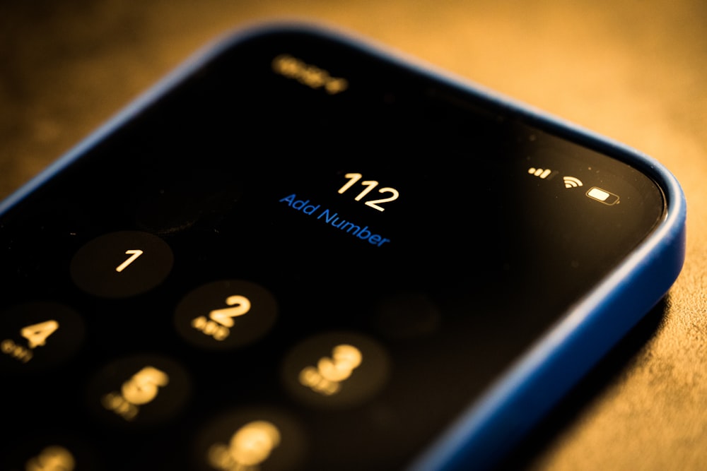 a close up of a cell phone on a table