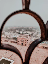 Visitors admiring the Alcazaba fortress with panoramic city views.