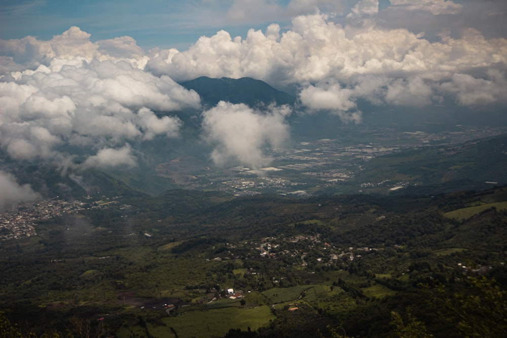 a view of a mountain range with clouds in the sky