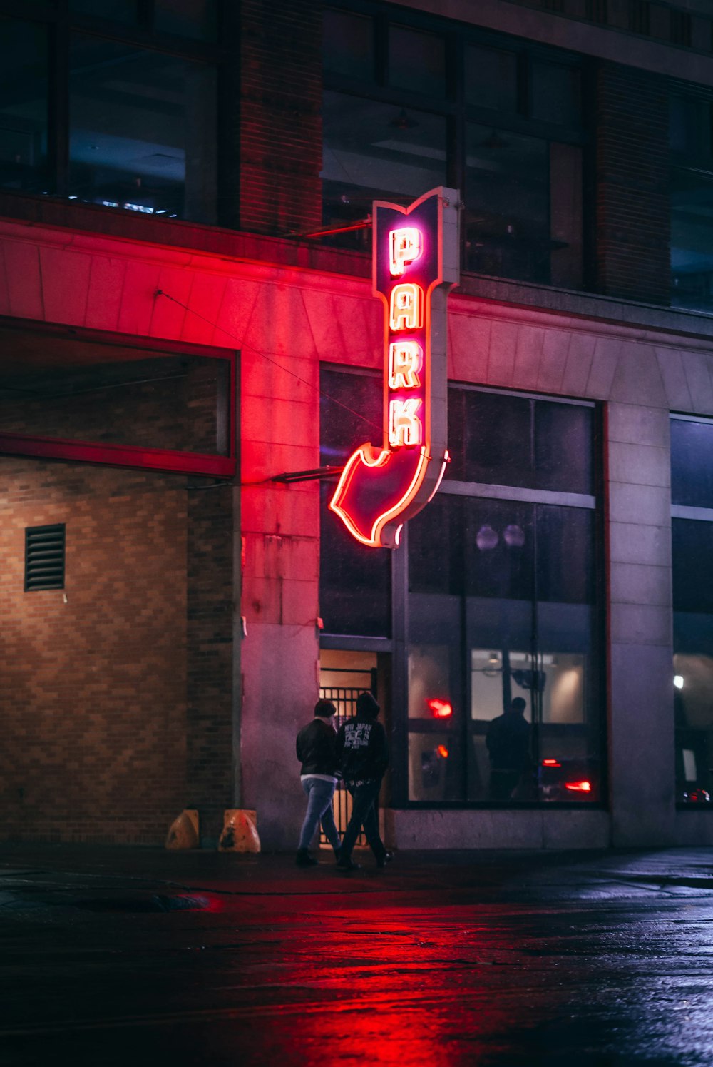 a neon sign on the side of a building