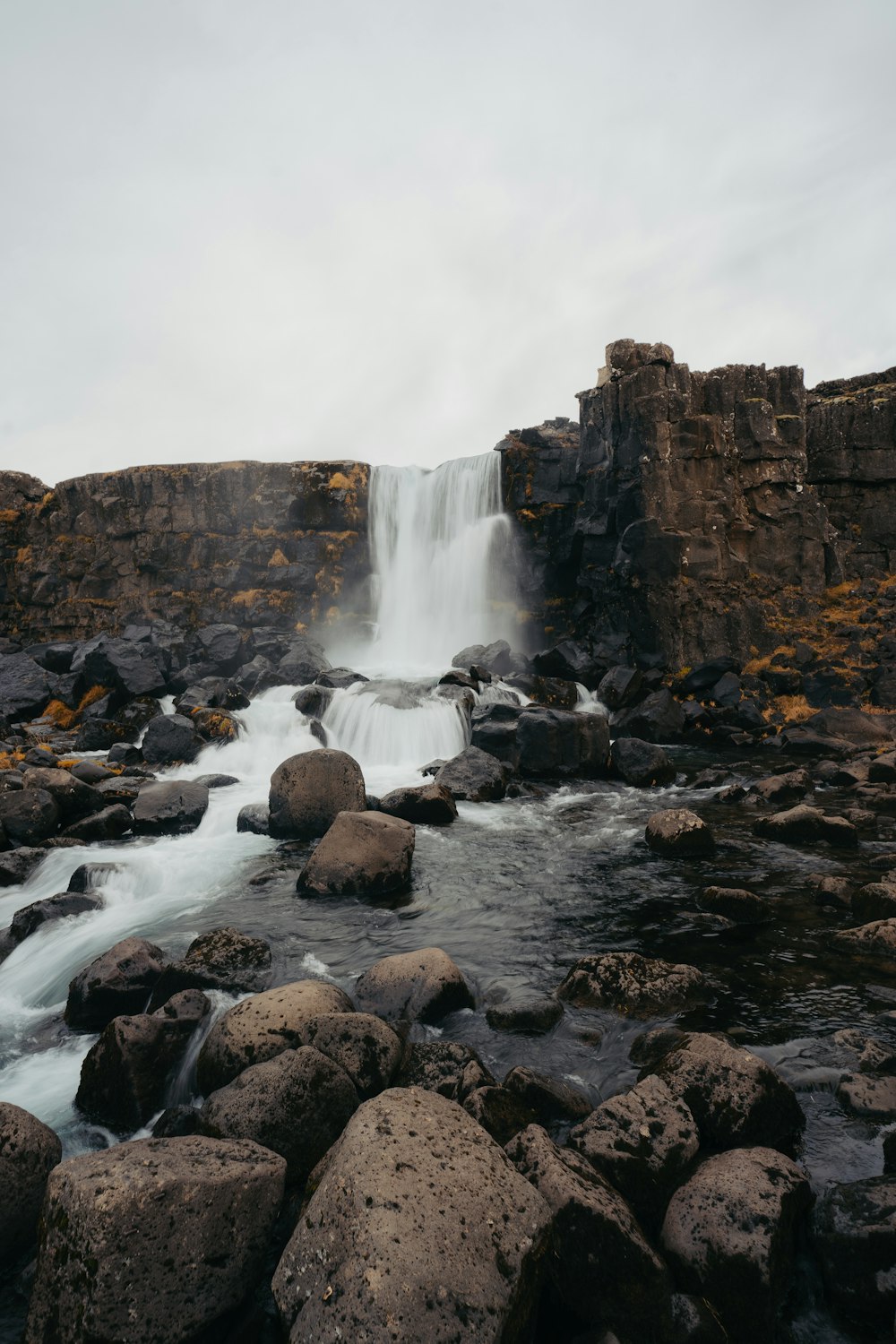 a waterfall with a large amount of water coming out of it